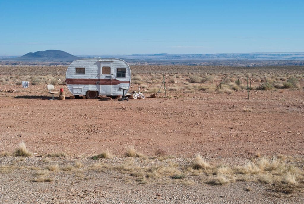 Small trailer in the middle of the Arizona desert.